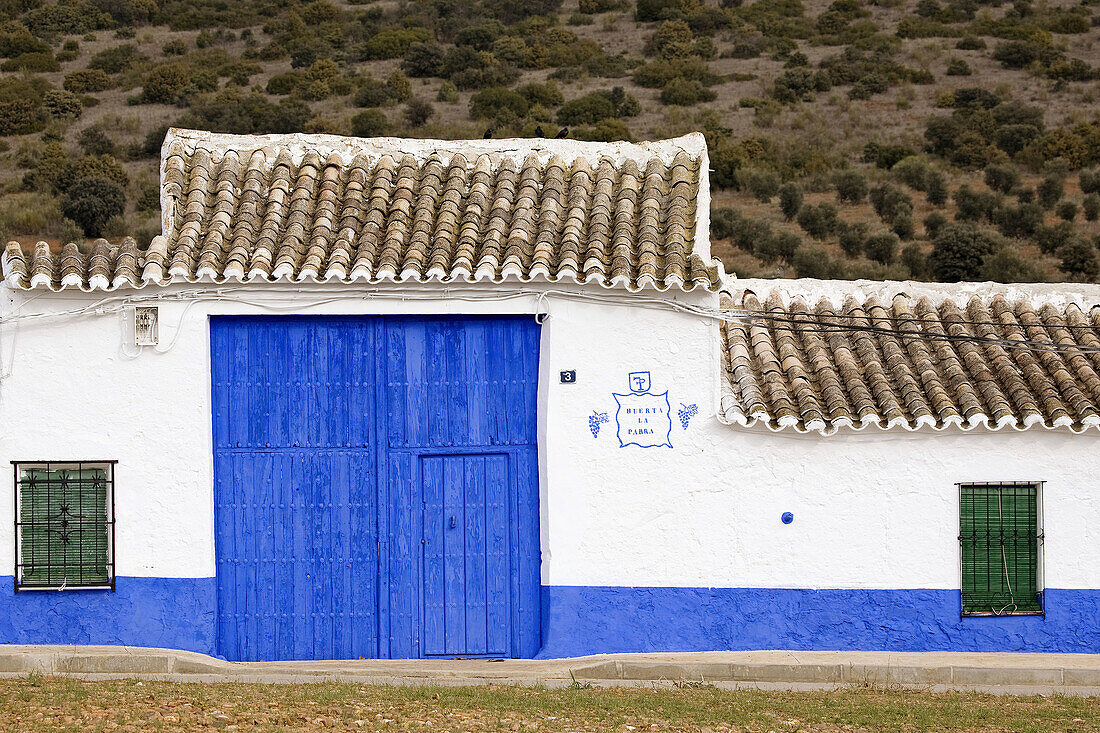 Blue door of ´cortijo´ typical country estate, Puerto Lapice. Ciudad Real province, Castilla-La Mancha, Spain