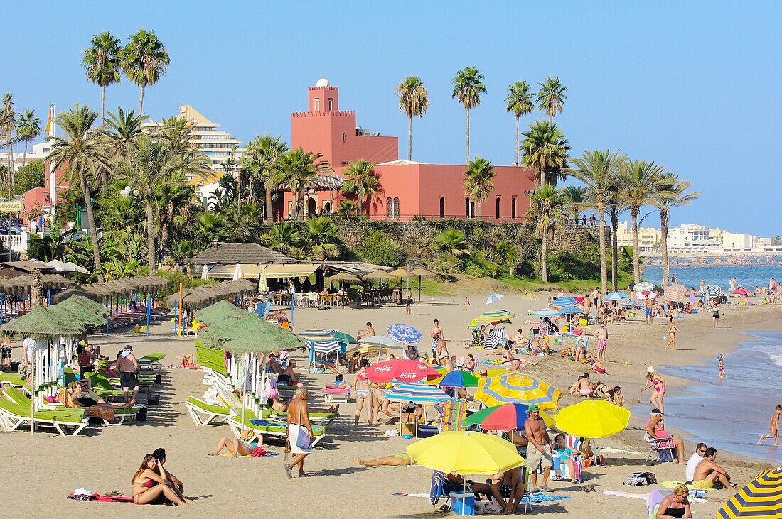 Beach and Bil-Bil castle in background, Benalmadena. Costa del Sol, Malaga province, Andalusia, Spain