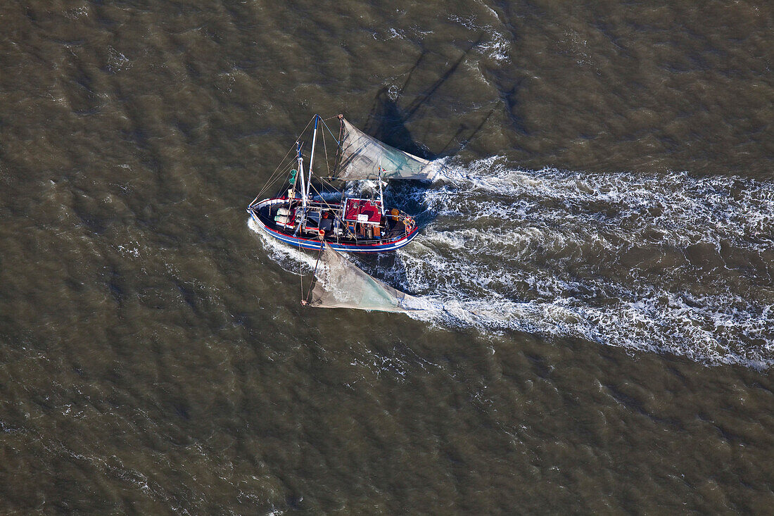 Aerial shot shrimper passing mouth of the River Elbe, Lower Saxony, Germany