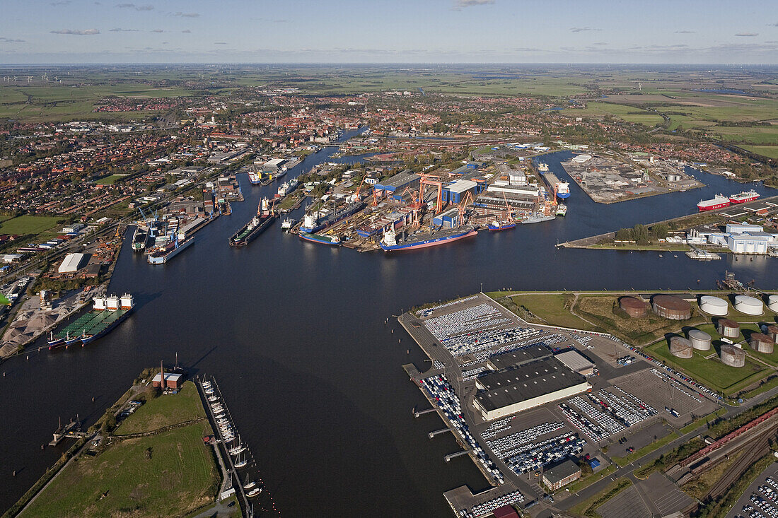 Aerial view of Emden seaport and the river Ems, harbour with container terminal, oil containers and export vehicles, Emden, Lower Saxony, northern Germany