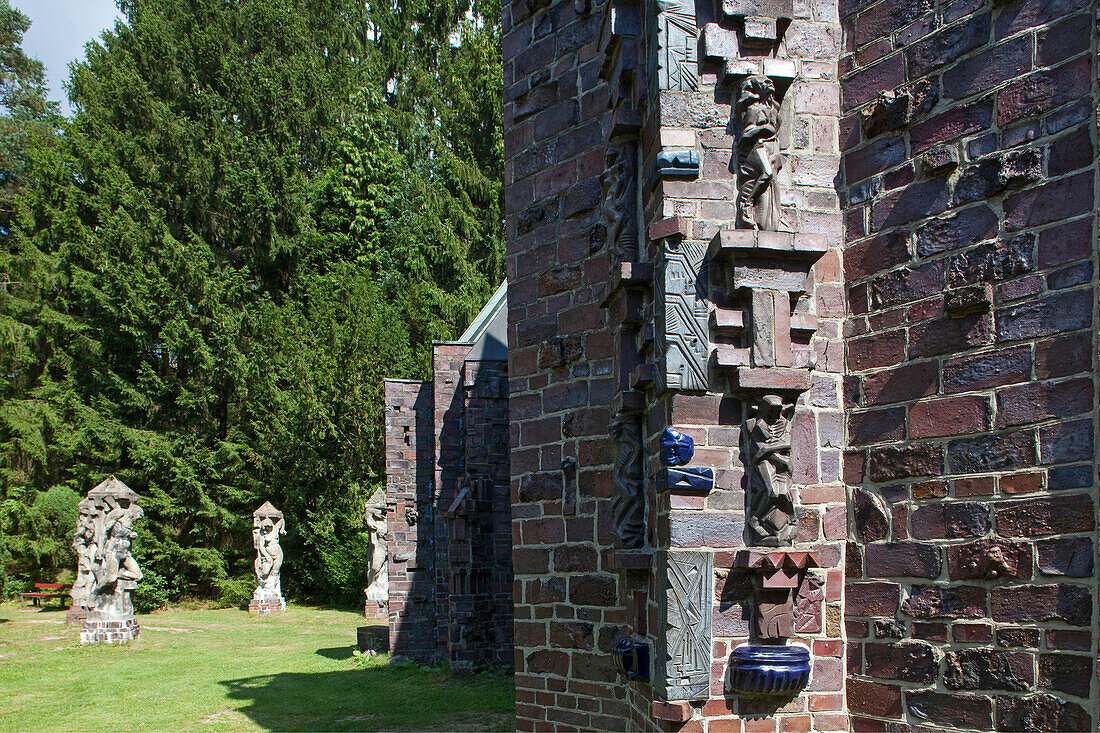Sculptures on the outside of a temple in Kunststätte Bossard near Jesteburg, Lower Saxony, northern Germany