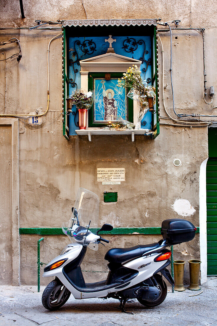 Scooter and the saint image, Palermo, Sicily, Italy