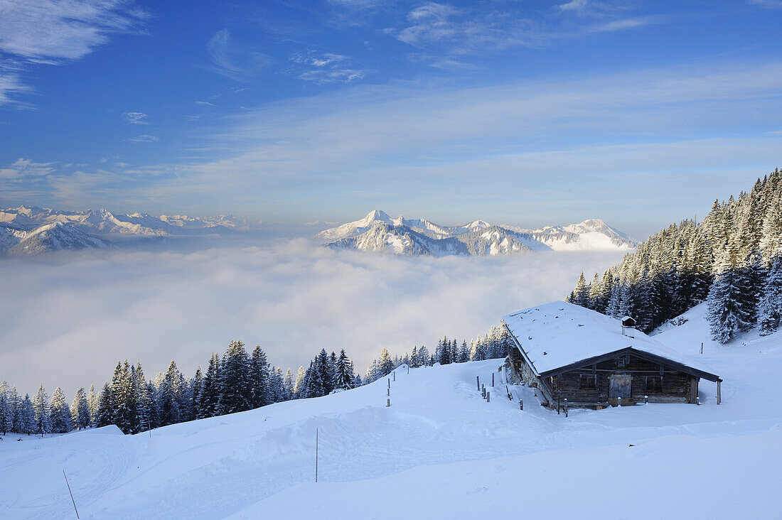 Snow-covered alpine hut with Karwendel, Wetterstein and Tegernsee mountain range in the background, Rotwand, Spitzing area, Bavarian Pre-Alps, Bavarian Alps, Upper Bavaria, Bavaria, Germany