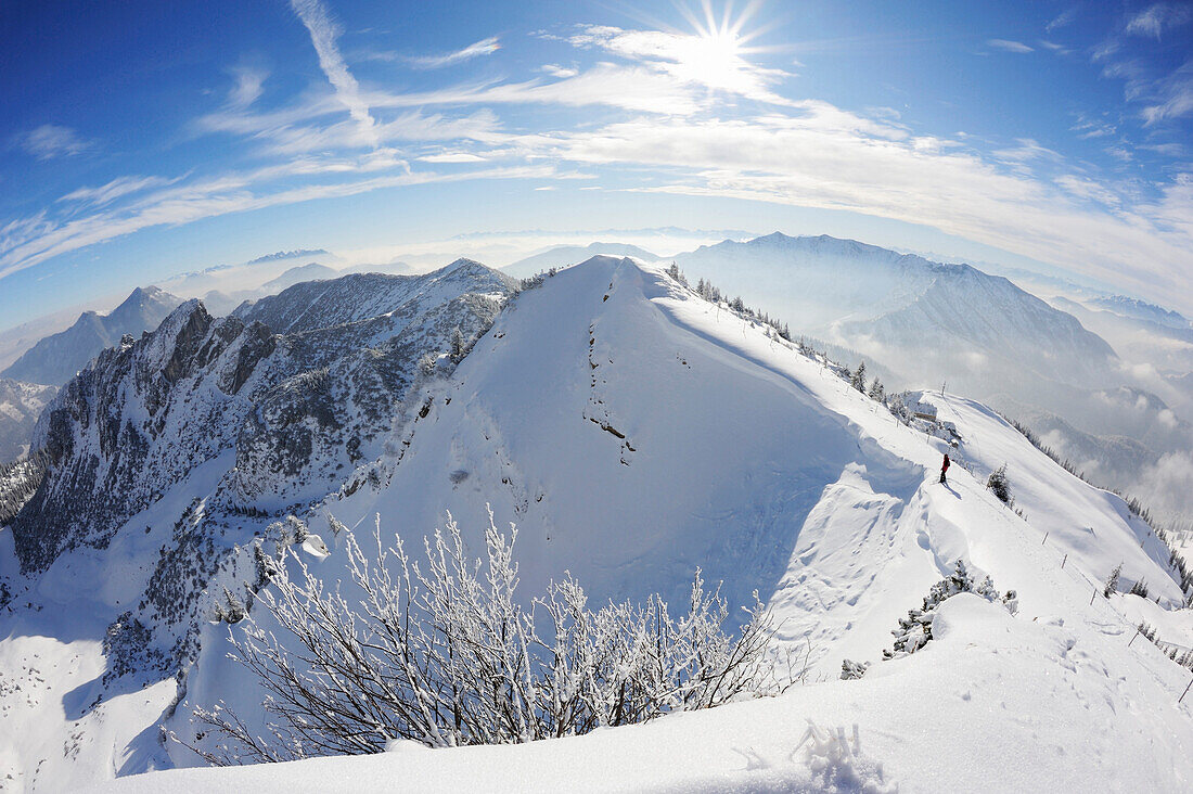Backcountry skier standing on the edge of a ridge at Rotwand, Rotwand, Spitzing area, Bavarian Pre-Alps, Bavarian Alps range, Upper Bavaria, Bavaria, Germany