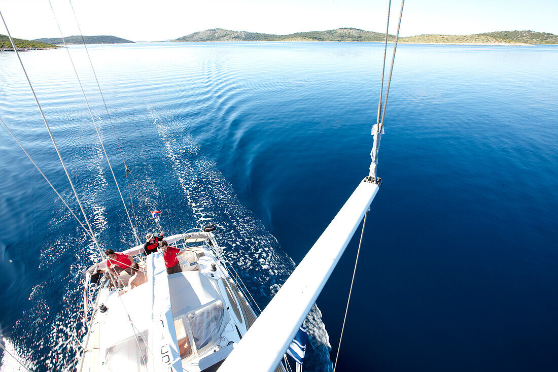 View from the mast to the crew of a sailing boat, Kornati archipelago, Croatia, Europe