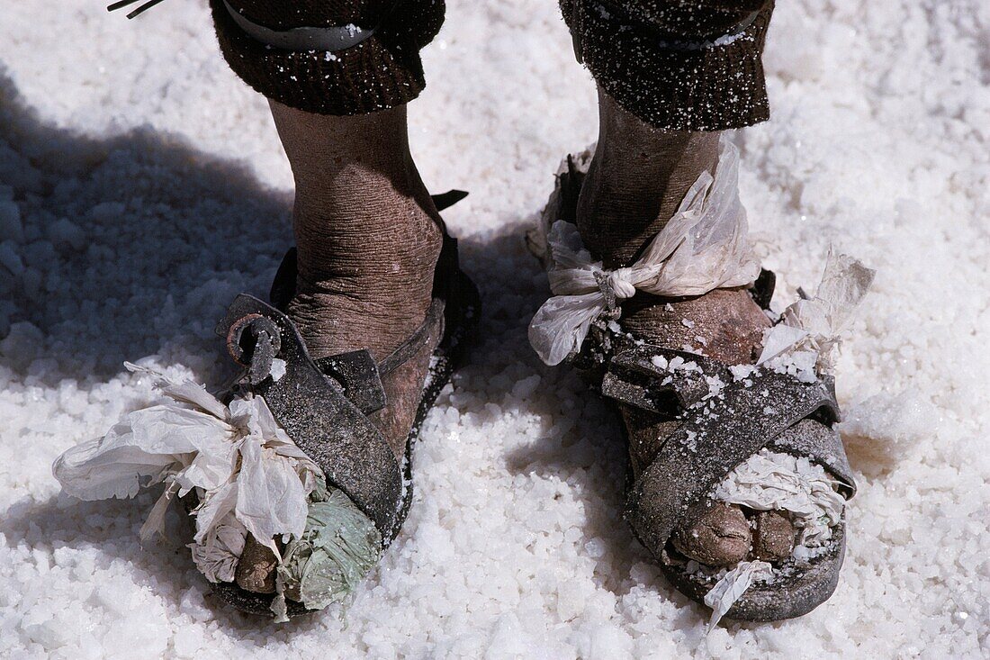 Bolivia, Salar of Uyuni, The feet of a salt worker