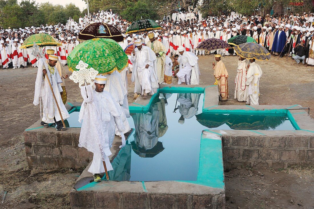 Ethiopia, Lalibela,Timkat festival, Orthodox priests going round the cross shaped pool where the baptism will take place  Every year on january 19, Timkat marks the Ethiopian Orthodox celebration of the Epiphany  The festival reenacts the baptism of Jesus