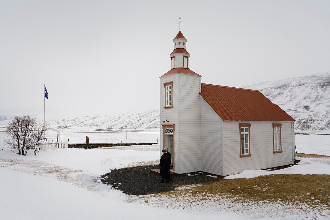 People leaving mass on Easter sunday  Goddalakirkja church, the church is 104 years old  Skagafjordur, Iceland