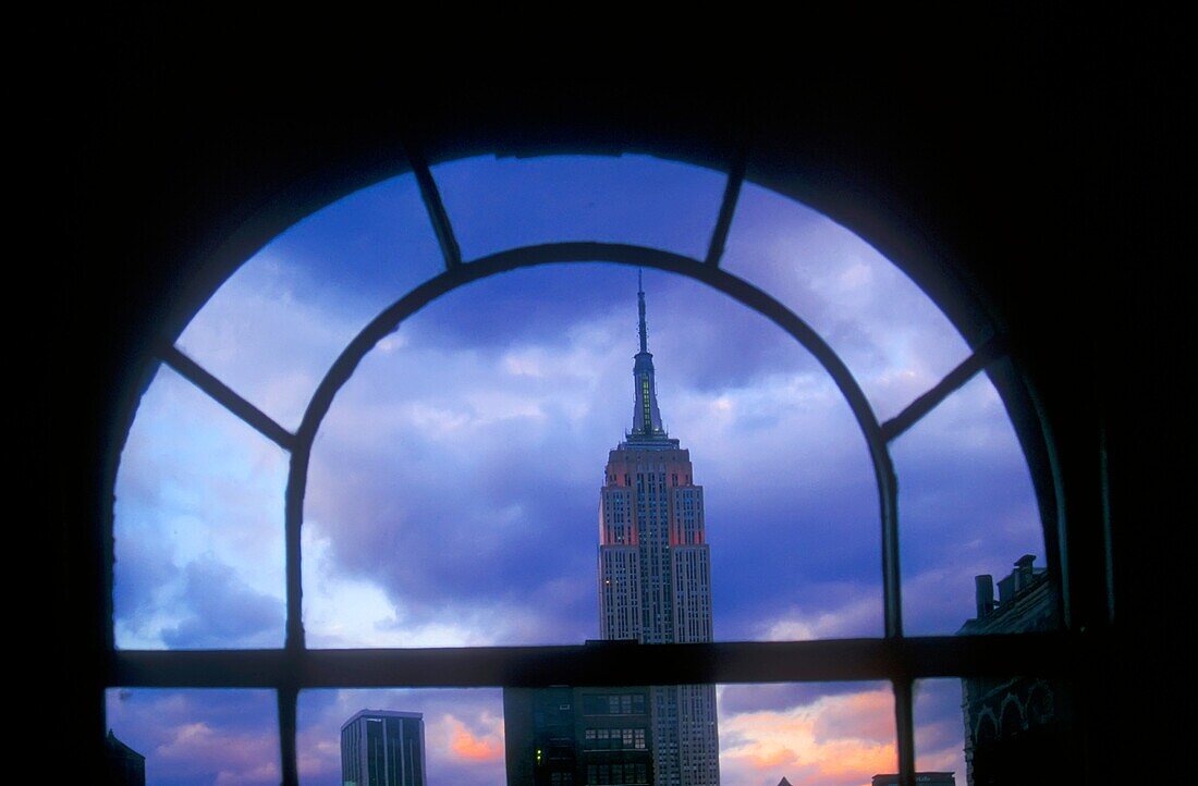 New York, NY - The Empire State Building, framed by a window in a Manhattan office building  Copyright Jim West