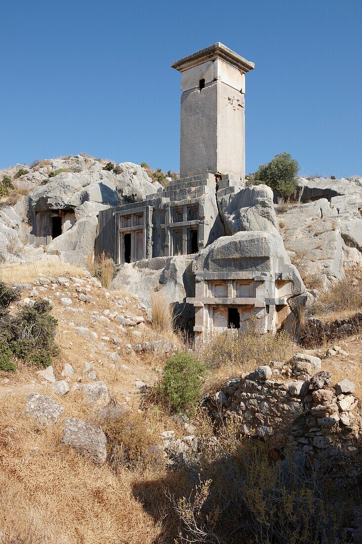 Typical Lycian pillar tomb and house type rock-cut tombs in Xanthos, an ancient Lycian city in the South West of modern Turkey