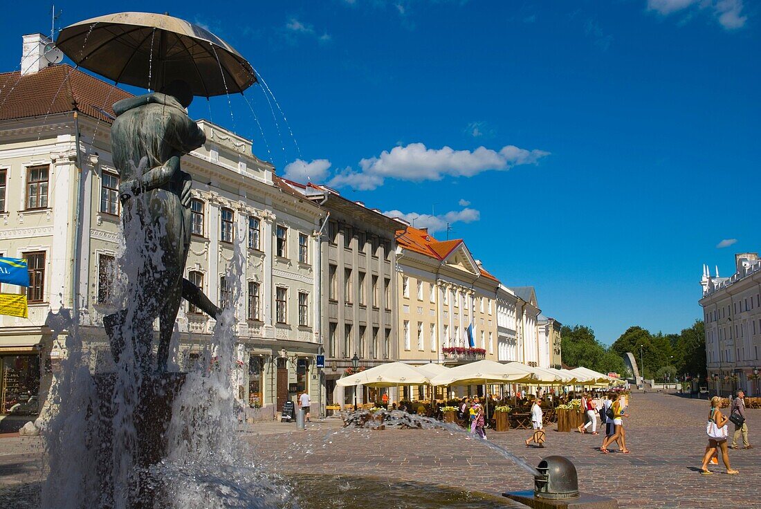 Raekoja Plats the main square with the kissing couple statue and restaurant terraces in Tartu Estonia Europe