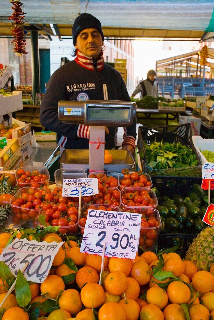Seller of fresh prouce at Rialto market in Venice Italy Europe
