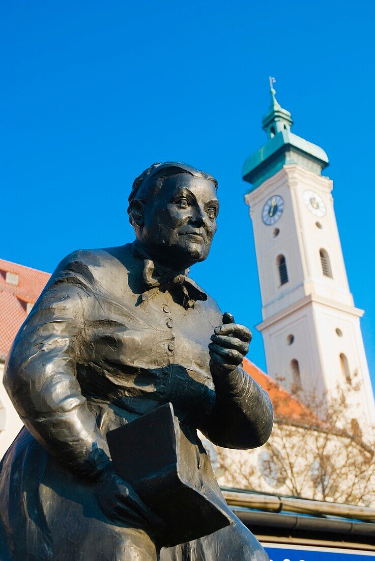 Statue and cathedral at Viktualienmarkt square old town Munich Bavaria Germany Europe