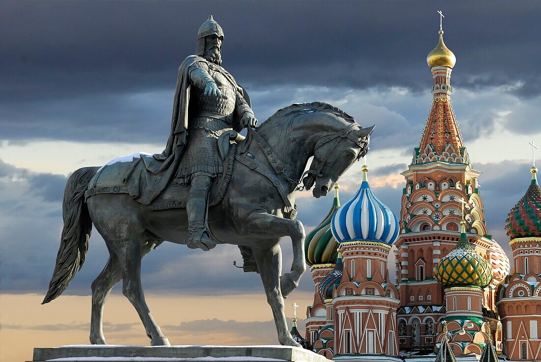 Monument of Youri Dolgorukiy and St  Basil cathedral on the dramatic sky background