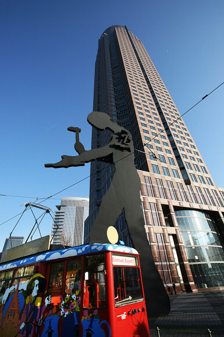 Ebbelwoi tram, hammering man sculpture, Messeturm, Frankfurt am Main, Hesse, Germany