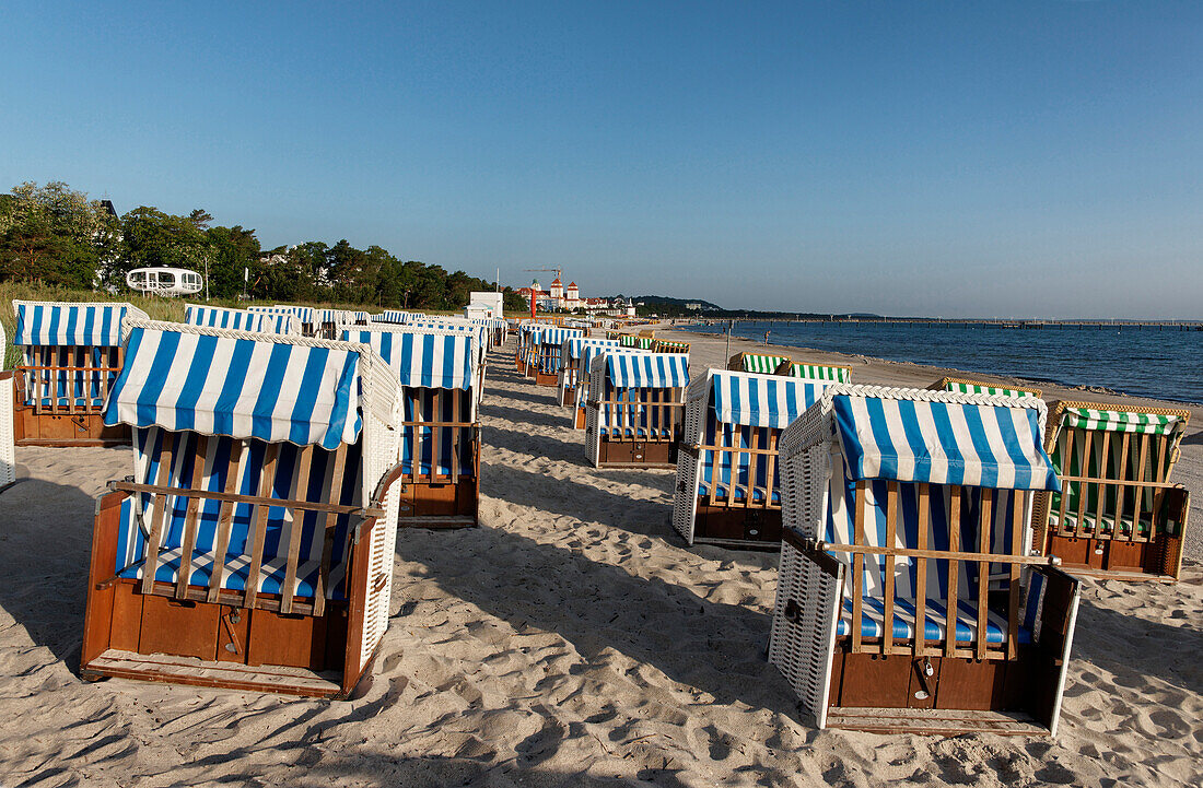 Roofed wicker beach chairs at sandy beach, Baltic sea spa Binz, Ruegen, Mecklenburg-Vorpommern, Germany