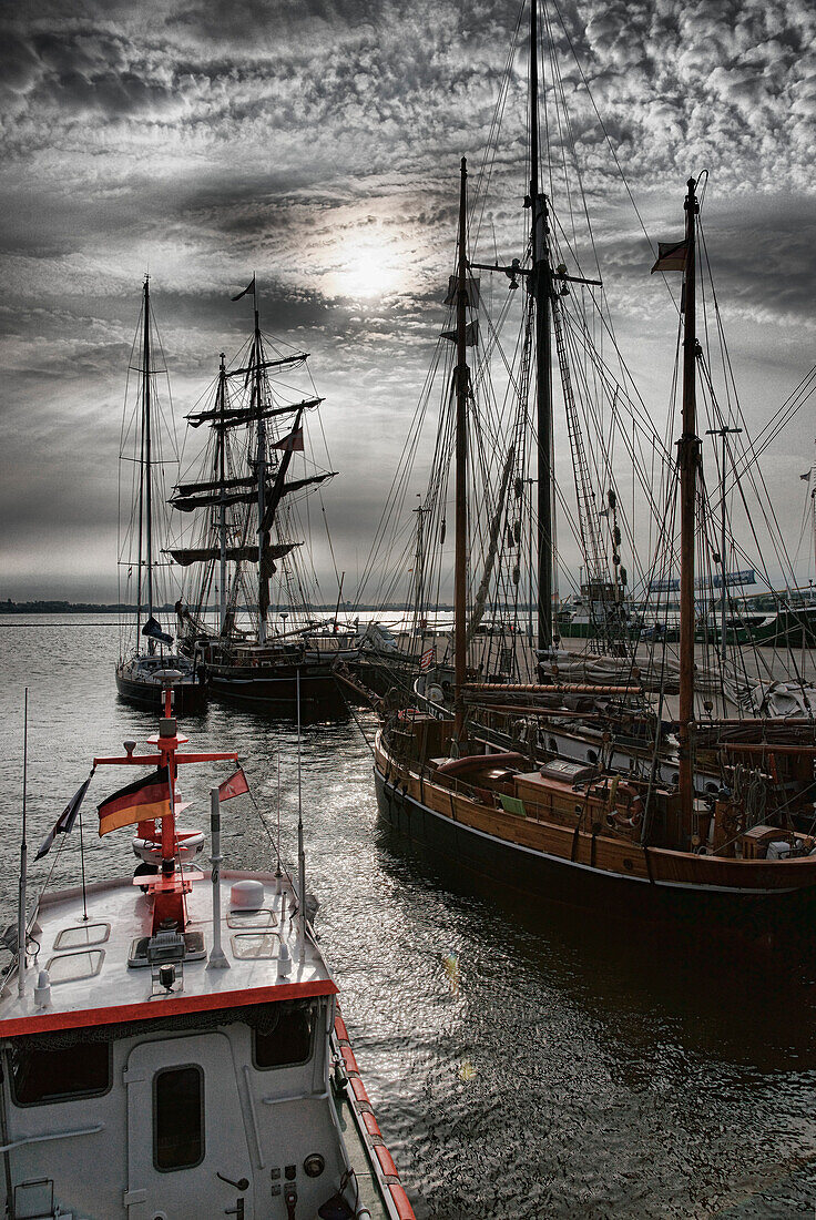 Sailing ships at harbour under grey clouds, Hanseatic town Stralsund, Mecklenburg-Western Pomerania, Germany, Europe