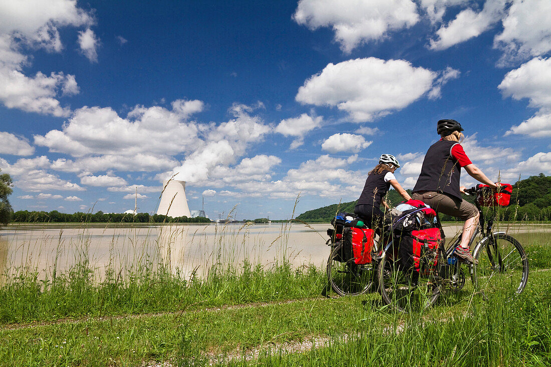 Cyclists passing Isar Cycle Route, Isar 1 Nuclear Power Plant, near Landshut, Lower Bavaria, Germany