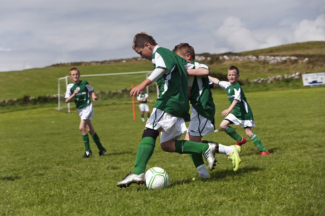 Young boys playing football, County Clare