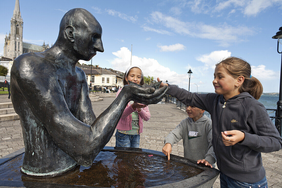 Children playing by a fountain, Cobh, County Cork, Ireland