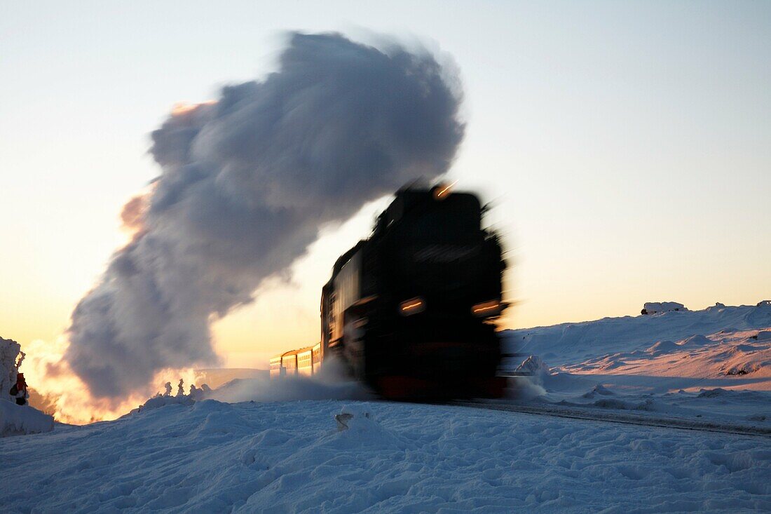 Steam train arriving at top of Brocken mountain in evening, Hochharz National Park, Sachsen-Anhalt, Germany