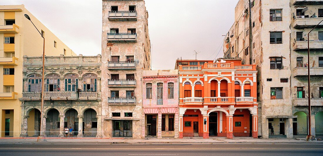 A renovated building amongst other dilapidated buildings on the Malecon in Havana, Cuba