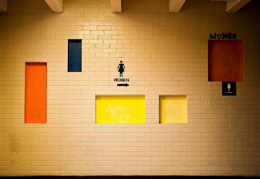 Women´s restroom directional sign at a roadside rest stop in the American southwest