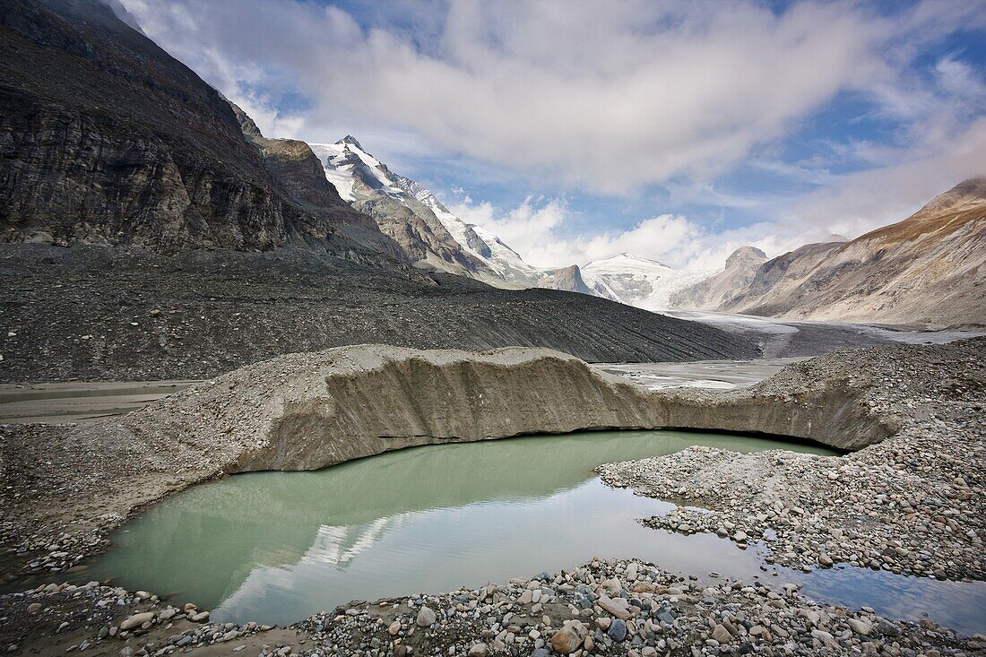 Glacier foreland and desintegration moraine landscape of glacier Pasterze near Grossglockner with lakes formed by melting of dead ice lakes  Beneath the thick cover of till huge masses of glacier ice still exists, wehn melting they form lakes and other ic