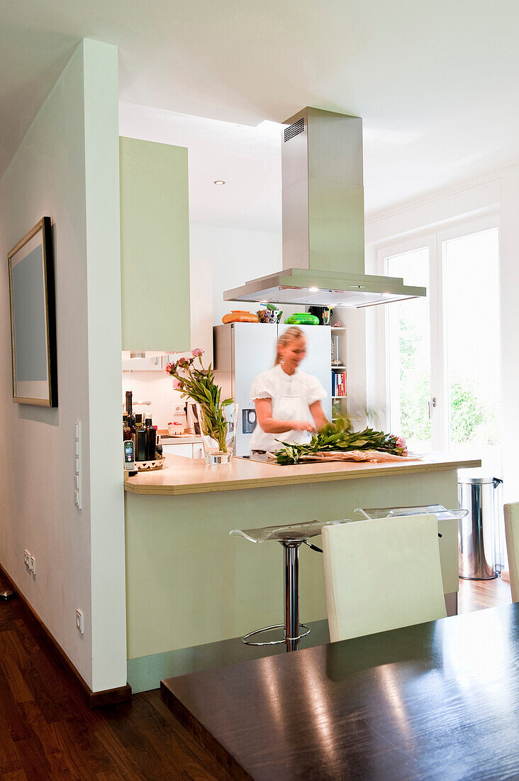 Woman in a kitchen, Hamburg, Germany