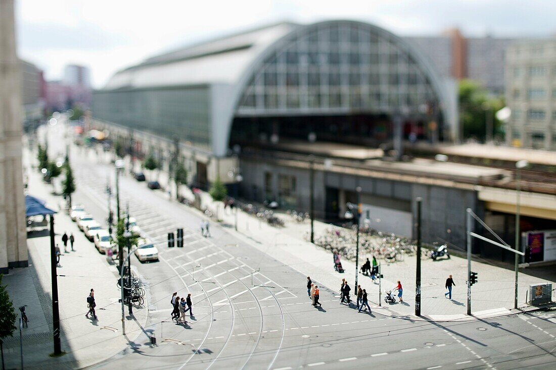 Walkers in front of Alexanderplatz station, Berlin, Germany  Tilted lens used for shallow depth of field