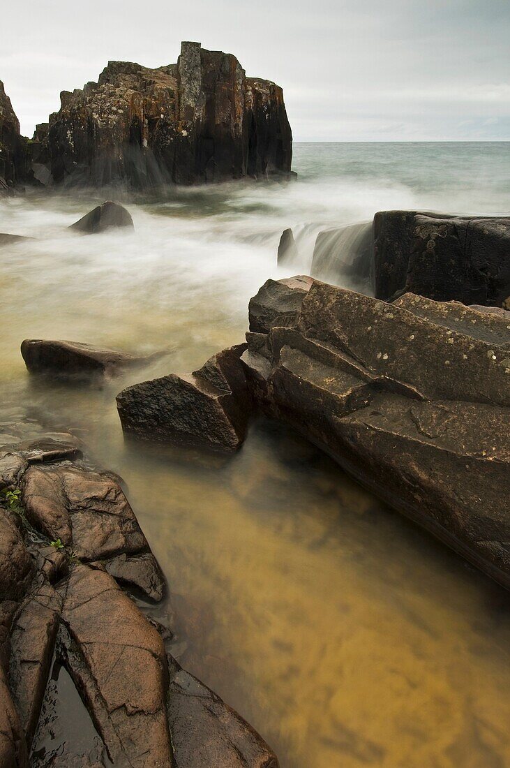 Waves rush through rocks along the North Shore of Lake Superior at Artists Point