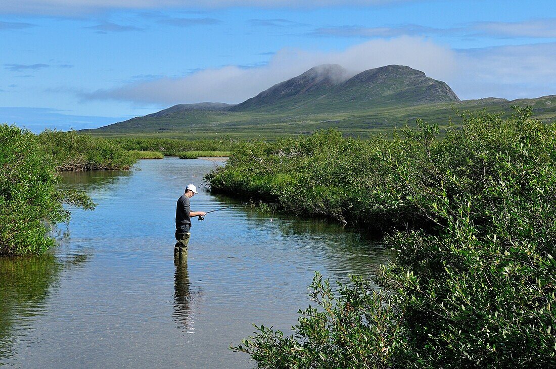 fisherman in a river, tundra valley in the Torngat Mountains National Park, Newfoundland and Labrador, Canada, North America