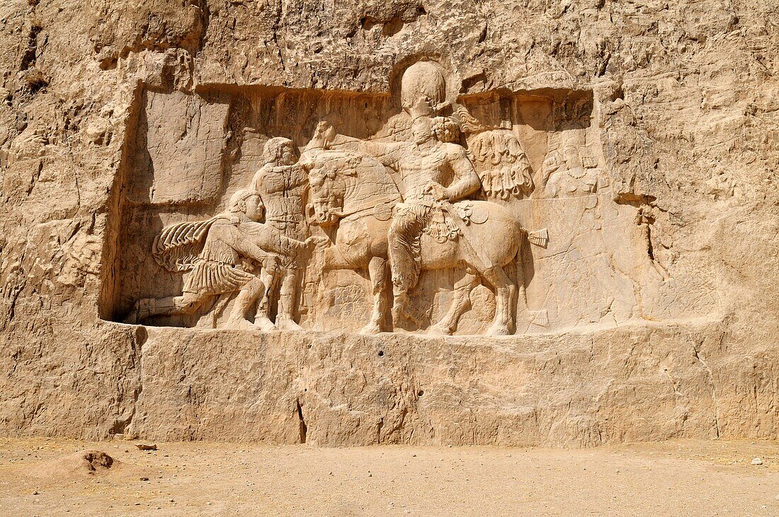 sassanid relief of the triumph of king Shapur I  over the Roman Emperor Valerian and Philip the Arab at the achaemenid burial site Naqsh-e Rostam, Rustam near the archeological site of Persepolis, UNESCO World Heritage Site, Persia, Iran, Asia