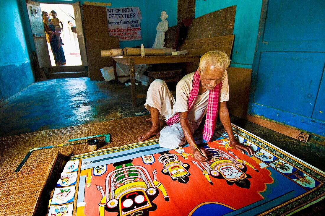 India,Orissa,Dandasahi village,Pattachitra worker,coating paintings