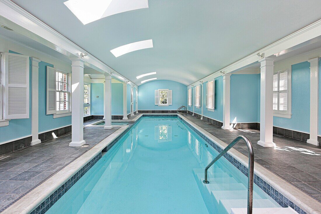 Long indoor swimming pool in luxury home