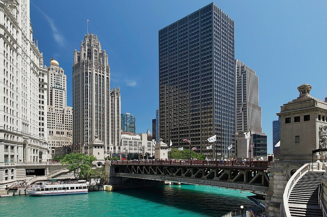 Downtown Chicago city scene with tour boat and bridge