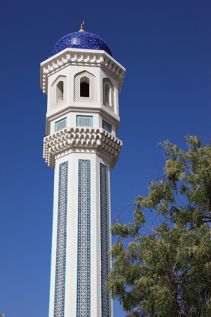 minaret tower of mosque in the district of Al-Khuwair, Muscat, Sultanate of Oman, Arab Country, Asia.