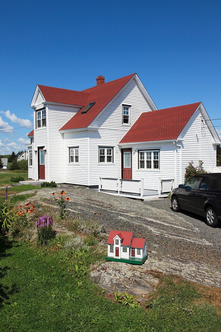 wooden Nova Scotian House and its model in garden. Nova Scotia, Canada, North America