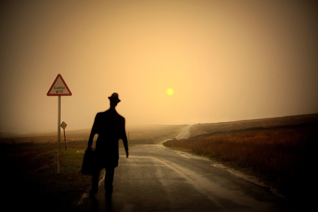 adult, Color image, contemporary, Country road, day, deserted, Digital composite, Empty road, end, escape, evening, figure, getaway, getting away, Going away, horizon, horizontal, human, isolated, isolation, lone, lonely, monochromatic, monochrome, Moving