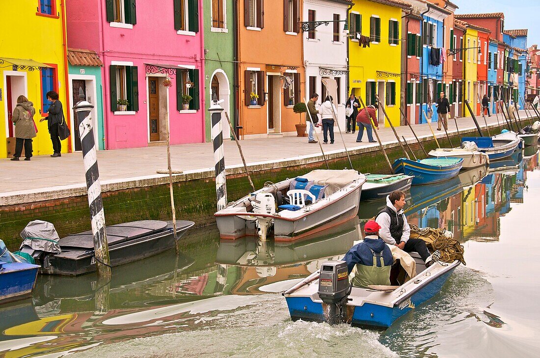 coloured houses and boats on canal, the island of Burano Venice Italy