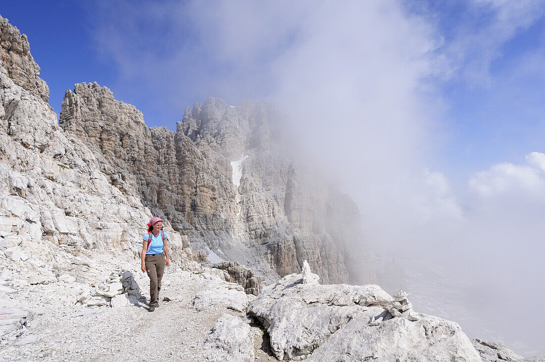 Woman mountain hiking, Bocchette way, Brenta group, Trentino-Alto Adige/Südtirol, Italy