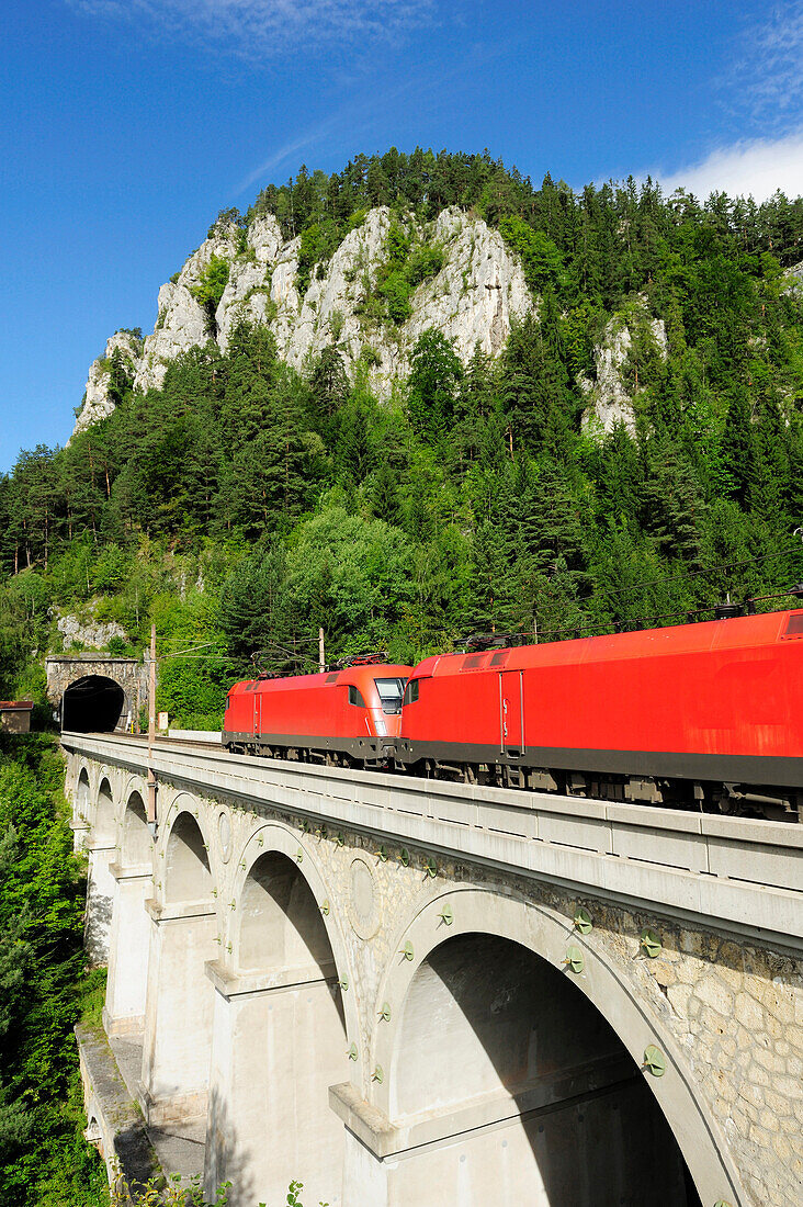 Train passing Krauselklause-viaduct, Semmering railway, UNESCO World Heritage Site Semmering railway, Lower Austria, Austria