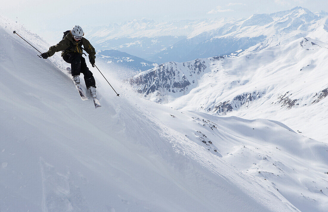 Woman downhill skiing in powder snow, Parsenn, Davos, Canton of Grisons, Switzerland