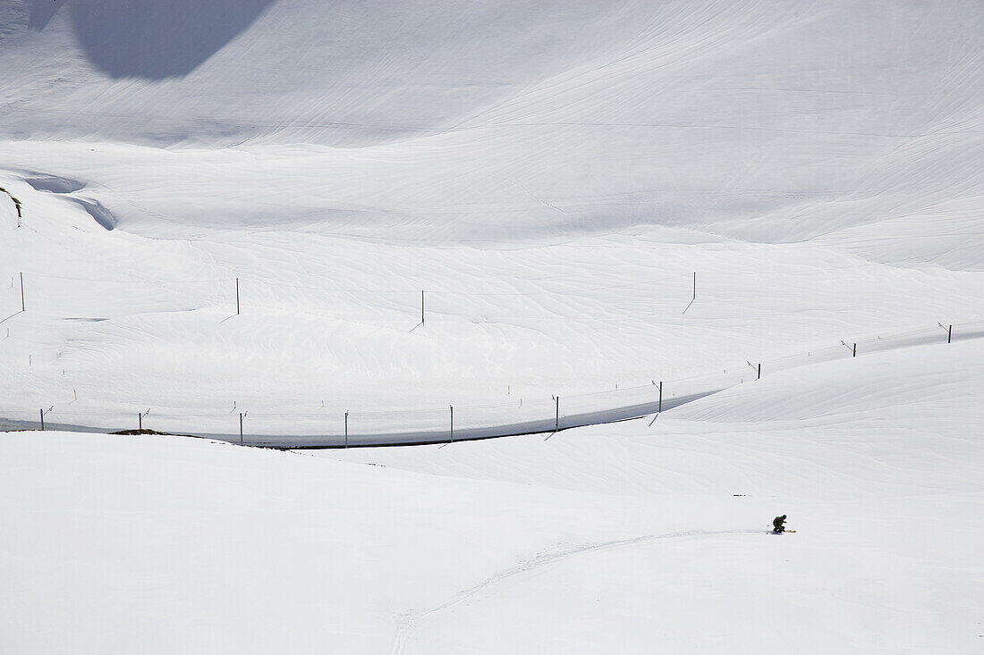 Downhill skiing in deep powder snow, Disentis, Oberalp pass, Canton of Grisons, Switzerland