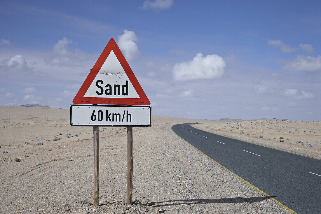 Warning sign on the roadside in the desert, Namibia, Africa