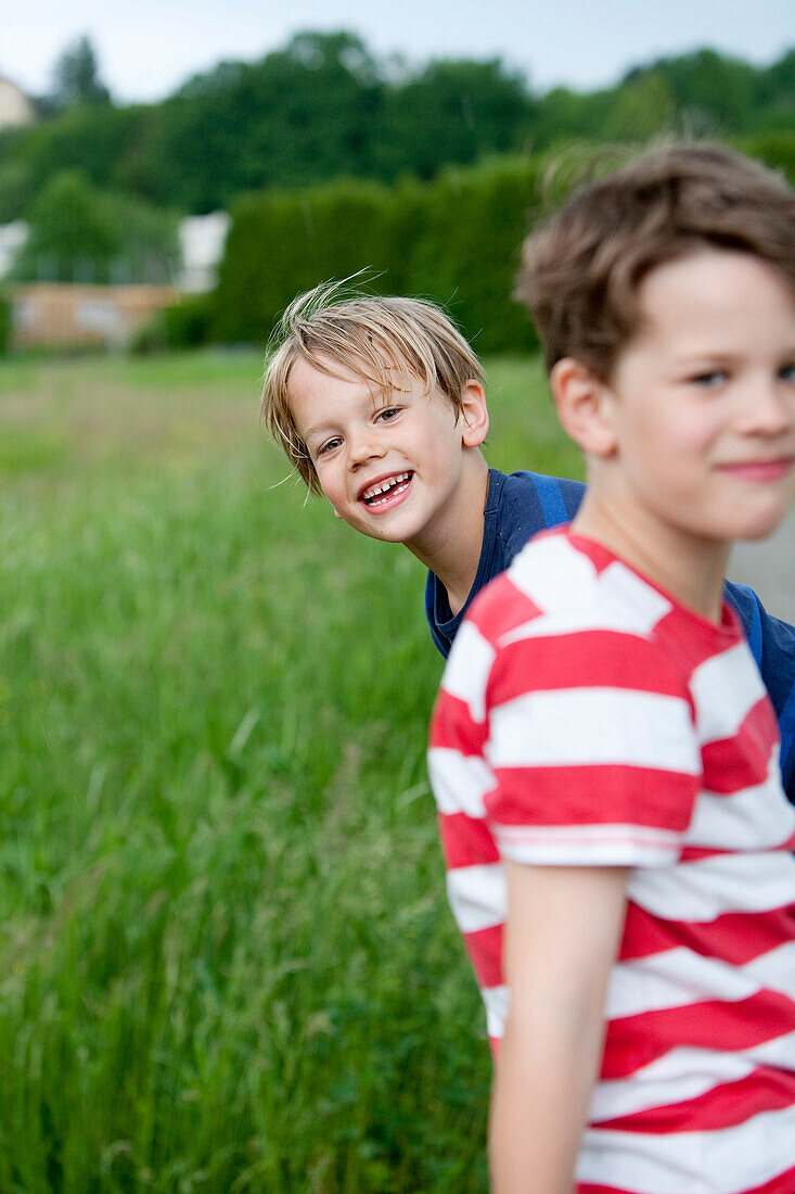 Two boys (6 - 7 years) smiling at camera