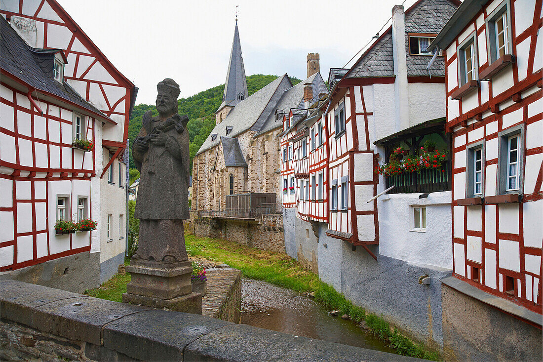 St. Nepomuk, bridge statue, half-timbered houses, Monreal, Eifel mountains, Rhineland-Palatinate, Germany
