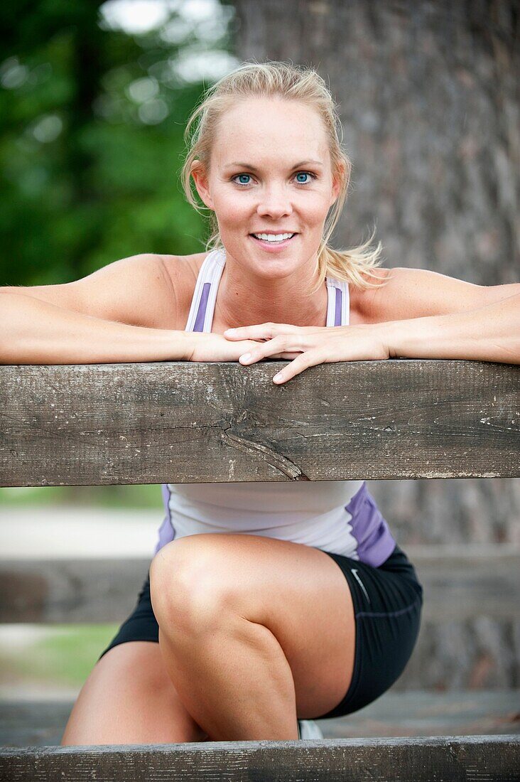 30 year old blonde woman in work out clothes smiling at camera