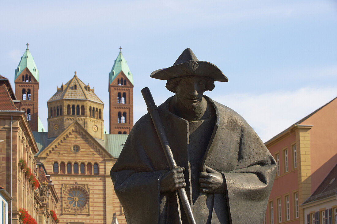 Sculpture of a pilgrim in Maximilianstraße and Speyer cathedral, Rhineland-Palatinate, Germany, Europe