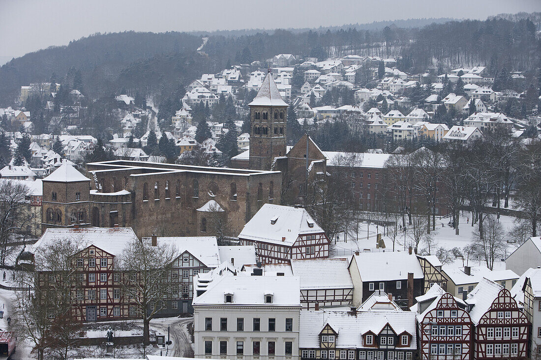 View from the parish church towards the Stiftsruine and the snow covered rooftops, Bad Hersfeld, Hesse, Germany, Europe